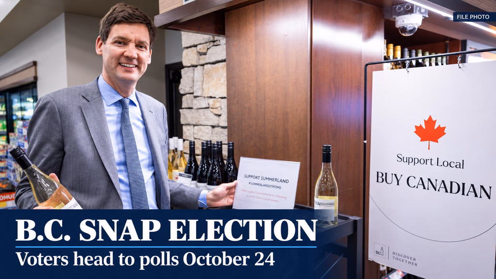 David Eby beside a Buy Canadian display